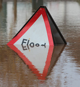 partially submerged flood sign