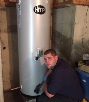 Technician Dane Kady installing an 80 gallon indirect fired water heater by Super Store