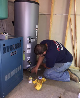Absolute Precision technician installing a water heater